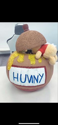 there is a stuffed animal on top of a hummy ball that says hummy