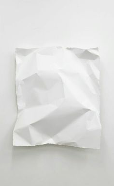 a piece of white paper that has been folded