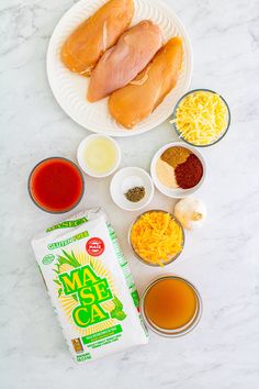 ingredients to make chicken broth laid out on a marble counter top, including eggs, cheese and seasonings