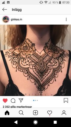 the back of a woman's neck with henna tattoos on it and an instagram