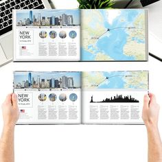 two hands hold open a magazine with images of new york and the world on it