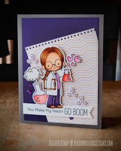 a handmade card with a woman holding a beakle and flasks on it