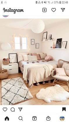 a bedroom with white walls and lots of pictures on the wall, including a bed