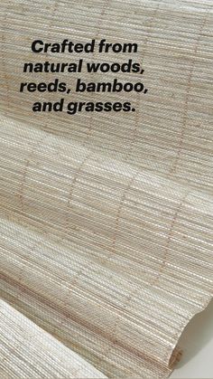 a roll of bamboo paper sitting on top of a white countertop next to a wall