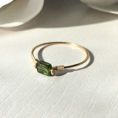 Please note: Shade of green and/or size & shape may vary slightly due to nature of the stone. This beautifully simple ring is lovingly handmade with a rectangle Tourmaline stone and a choice of 14k Gold Filled, 14k Rose Gold Filled or Sterling Silver band. M A T E R I A L S: * Green Tourmaline * 14k Gold Filled, 14k Rose Gold Filled or Sterling Silver S I Z E: *  Gemstone - Approximately 4-6mm *  Band Thickness - Approximately 0.8-1mm  All of our jewellery is carefully handmade using good quality materials and handpicked gemstones, with the aim to produce quality pieces that you can love & wear for years to come.  T O U R M A L I N E: * October Birthstone * Talisman for Capricorn, Aries, Virgo & Libra  * Heart Chakra Tourmaline aids in understanding oneself and others.  It promotes self-co Silver Wire Rings Handmade, Handmade Rings Wire Simple, Rings From Wire, How To Make Rings Out Of Wire, Wire Wrap Rings, Diy Wire Jewelry Rings, Silver Wire Rings, Jewellery Wire