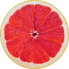 a grapefruit cut in half sitting on top of a white plate with yellow trim