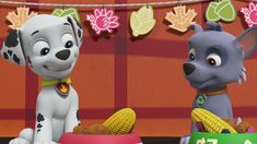 two cartoon dogs are eating corn on the cob