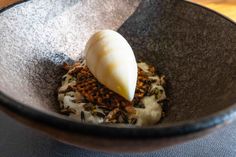 a bowl filled with food on top of a table