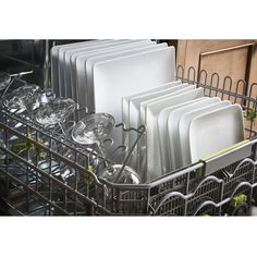 a dishwasher filled with dishes and glasses