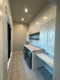 a washer and dryer in a very large room