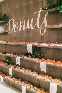 a display case filled with lots of different types of doughnuts and pastries