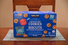 a box of cookies sitting on top of a wooden table