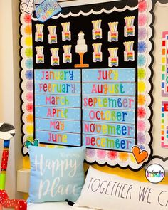 a colorful bulletin board is hanging on the wall above a bed with pillows and other decorations