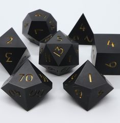 black and gold dice with numbers on them