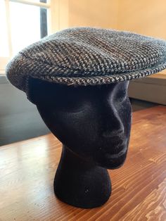 Vintage stylish mens or ladies gray tweed newsboy hat. Great shape for age. No rips, tears, stains. Two working snaps on bill of hat. Size large. Made in USA label. 100% pure wool. Gray, white with blue and burgandy accent colors. No manufacturer noted. Dimensions:  22 inches around at base of hat. Vintage Gray Hat, One Size Fits Most, Vintage Gray Hat, Classic Adjustable Tweed Hat, Tweed Flat Cap, Vintage Gray Hat, One Size, Grey Tweed, Lady Grey, Newsboy Cap, News Boy Hat