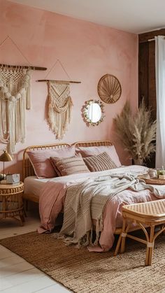 a bedroom with pink walls and wicker furniture