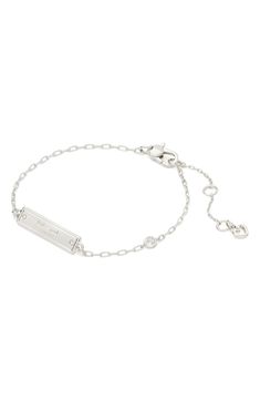 Cubic zirconia accents sparkle on this statement-making bar bracelet that's inspired by the brand's iconic handbag. 6 3/4" length; 1 1/2" extender Lobster clasp closure Silvertone plate/cubic zirconia Imported Luxury Elegant Kate Spade Bracelet, Kate Spade Bracelet, Bracelet In Silver, Bar Bracelet, Bar Bracelets, Kate Spade New York, Silver Bracelets, Christmas List, Lobster Clasp