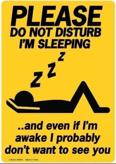 a sign that says, please do not disturb i'm sleeping and even if i'm awake i probably don't want to see you