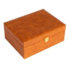 a brown leather box sitting on top of a white surface