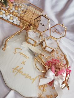 the table is decorated with gold and white decorations