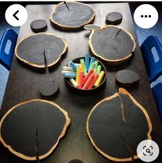 there are several pieces of wood that have been cut into shapes and placed in a bowl