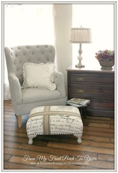 a chair and foot stool in a room