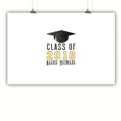 a white poster with the words class of 2018 and a graduation cap on it, hanging from