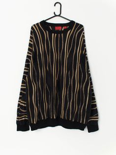 Vintage Coogi style sweater with bold gold stripes. This beautiful sweater has a 3D knitted effect, in black and gold. This coogi sweater is perfect all year round and will look great will everything! The sweater is made from a soft, mid-weight cotton. By J. Simon.  Our recommended size: Large to XL Label says: 2XL / 2TG Condition: Very good  Material: 100% cotton Measurements in inches: Pit to pit: 25.5 Shoulders: 27 Front length: 31.5 Back length: 30.5 Sleeve length: 24 Hem unstretched: 20 Hem Coogi Sweater, Pullover Sweater Men, Beautiful Sweater, Style Sweater, Gold Stripes, Pullover Men, Vintage Wear, Black And Gold, Aesthetic Clothes