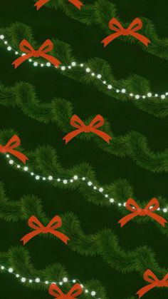 a green background with red bows and lights