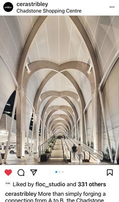 the inside of an airport with many arches and stairs