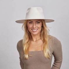 Rancher Vivid | Womens Colored Felt Fedora Hat is perfect for women who want to make a bold statement. Crafted from wool felt with a wide brim, its vibrant colors and sleek design add a pop of style to any look. Material: Wool Felt Shape: Tear Drop Western Trim: No Trim Brim Size: 3 1/2" Crown Height: 4 1/8" Sweatband: Adjustable Velcro Sweatband Imported Chic White Fedora With Flat Brim, White Beach Hat For Fall, Chic White Flat Brim Fedora, Modern White Hat With Curved Brim, White Casual Felt Hat For Fall, Casual White Felt Hat For Fall, White Flat Brim Fedora For Fall, Trendy White Fedora With Flat Brim, Chic White Fedora Felt Hat