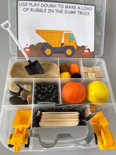 a plastic container filled with construction toys and other items to make a dump truck craft