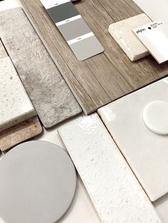 several different types of tile and flooring on display in a room with white walls