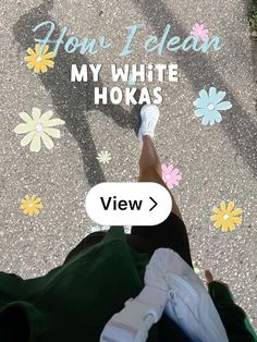 someone is laying down on the sidewalk with their feet in the air and text that reads, you're clean my white hokas view