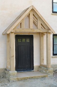 a black front door on a white house