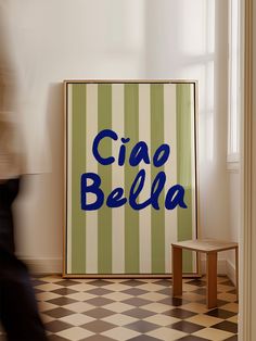 a poster with the word cia bella on it in front of a checkered floor