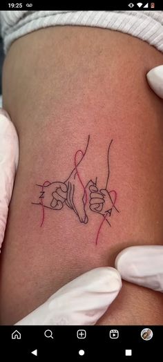 a woman's thigh with a tattoo on it