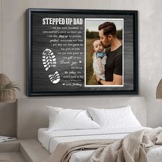 a man holding a baby in his arms with the words stepped up dad on it