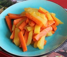 a blue plate topped with cut up carrots