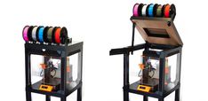 two machines with different colored tapes on top of each other and one machine in the middle