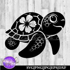 a black and white turtle with flowers on it's head, in front of a wooden