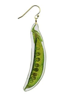 a pair of earrings with a cucumber hanging from it