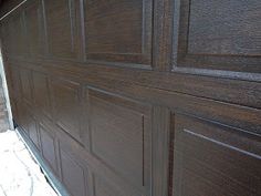 a close up of a wooden garage door