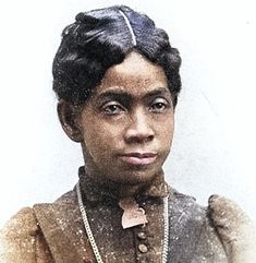 an old photograph of a woman with short hair and necklaces on her neck, looking at the camera