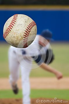 a baseball is in the air as it flies towards the ground with its mitt on