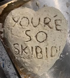 a heart shaped cake with the words you're so kind written on it in frosting