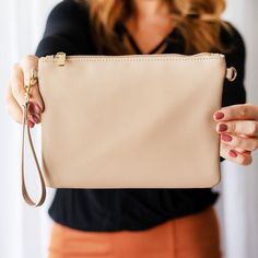 The Madeline Wristlet is the perfect addition to your purse collection! This classic style purse pairs perfectly with any outfit and comes with a matching wristlet strap. Pro Tip: Check out our collection of interchangeable crossbody and wristlet staps to switch up the look of this beautiful purse. 9.75" L x 7" H Vegan Leather Interior Lining Zipper Closure Removeable Wrist Strap: .375" W x 11" Circumference Purse Collection, Beautiful Purse, Gold Flecks, Best Jeans, Workout Gear, Leather Interior, Wrist Strap, Vegan Leather, Jewelry Gifts