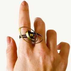 Lit Clue Recycled Rebirth Brass Ring Handmade by Elif of Lit Clue jewelry, this ring is one of the biggest statement rings I have seen. If you love bold jewelry - this ring is perfect! Transform your everyday look with our Kinetic Spiral Ring. This conversation-starting piece features a fluid brass spiral that moves independently, bringing an element of interactive art to your jewelry collection. Thoughtfully crafted from recycled brass, it's both environmentally conscious and boldly beautiful. Big Statement Rings, Spiral Ring, Interactive Art, Bold Jewelry, Environmentally Conscious, Brass Ring, Ring Handmade, Clue, Bracelet Gift