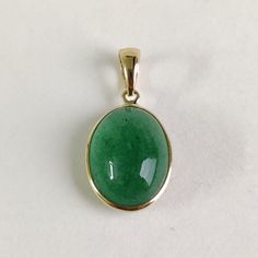 ITEM DESCRIPTION: >> The Pendant is made from Solid 14K Yellow Gold. Gemstone used is absolutely natural and ethically sourced. >> Natural Green Aventurine in oval shape and bezel setting is studded on it with utmost precision.  >> This is a minimalist design and is absolutely hassle-free and everyday jewelry.  Gem: Green Aventurine  Gem size: 10x14 mm oval Gem weight: 5.29carats Gold purity: 14K (58.33% approx.) Gold weight: 0.53 grams  Gross weight: 1.59 grams The Gold purity is guaranteed and it comes with authentic 14K gold hallmark. Since this Pendant are handmade, It is Nickel/Lead FREE.  CUSTOMISATION: --> You can choose your own gemstone. Kindly drop a message for more options. CUSTOMER SUPPORT: We are available 24/7 to respond to all your queries!  PACKAGING: The pendant comes in Green Aventurine Jewelry, Aventurine Jewelry, Handmade Jewelry Box, May Birthstone, Bezel Pendant, Birthstone Pendant, Strawberry Quartz, Yellow Gold Pendants, Unique Gemstones