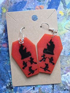 "Every day is Halloween, isn't it? For some of us." -Time Burton These spooky earring sets are made using epoxy resin, silicone molds, pigment powder, and 925 silver plated hypoallergenic earring hooks. The coffin charms measures 6.2 cm x 5 cm and are attached to the 20mm earring hooks by silver plated jump rings.  There's one in every color, so make sure you grab your favorites before they're gone as I am not currently taking commissions on them! Pigment Powder, Hypoallergenic Earrings, Jump Rings, Silicone Molds, Earring Set, 925 Silver, Witch, Jewelry Earrings Dangle, Dangle Drop Earrings